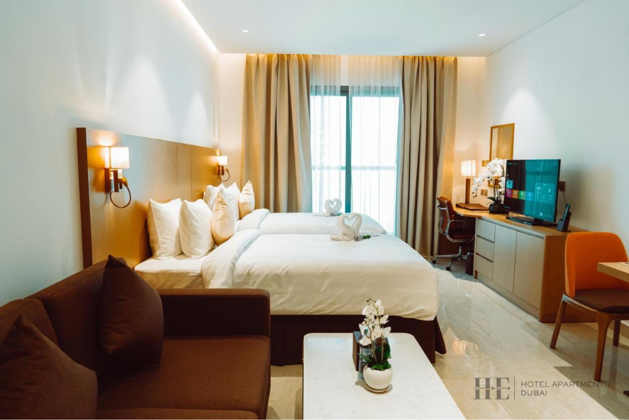 He Hotel Apartments Dubai Ruang foto Deluxe Room
